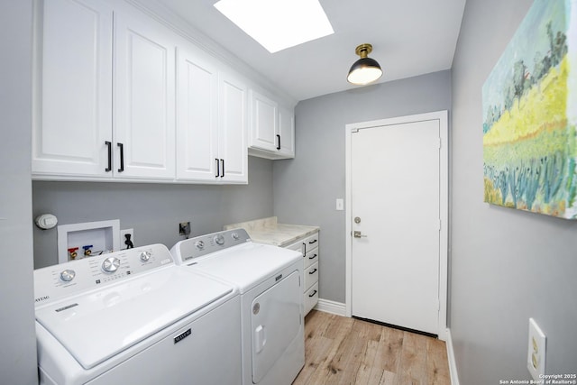3470 River Path, San Antonio, TX 78230 - laundry area featuring cabinet space, light wood finished floors, washing machine and dryer, a skylight, and baseboards