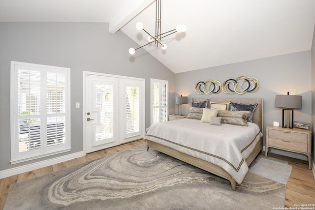 3470 River Path, San Antonio, TX 78230 - bedroom with access to outside, a chandelier, wood finished floors, beam ceiling, and baseboards