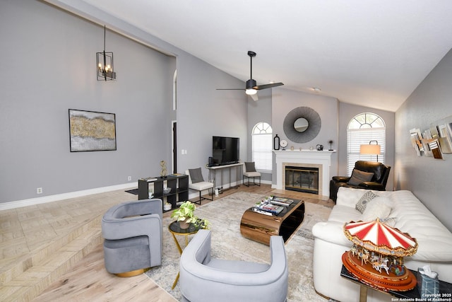 3470 River Path, San Antonio, TX 78230 - living area featuring lofted ceiling, plenty of natural light, a fireplace, a ceiling fan, and baseboards