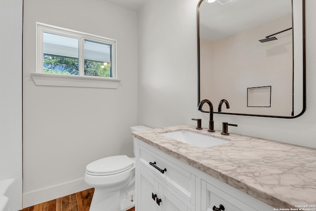 339 Thorain Blvd, San Antonio, TX 78212 - full bath with vanity, toilet, and wood finished floors