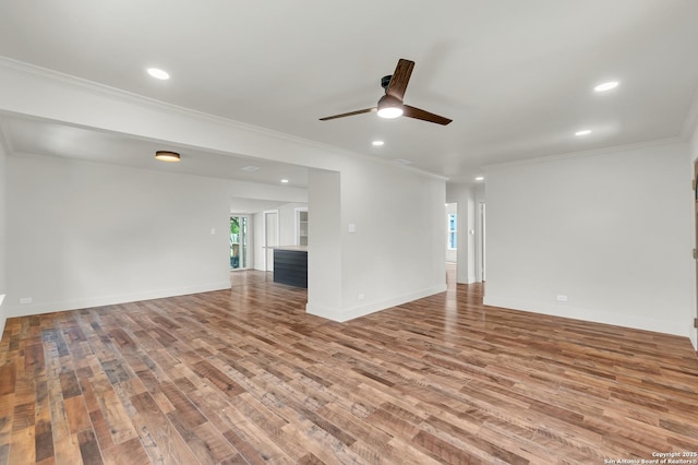 339 Thorain Blvd, San Antonio, TX 78212 - unfurnished living room with wood finished floors, a ceiling fan, recessed lighting, ornamental molding, and baseboards
