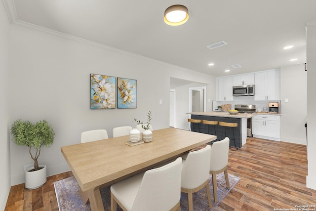 339 Thorain Blvd, San Antonio, TX 78212 - dining space featuring ornamental molding, recessed lighting, light wood-type flooring, and baseboards