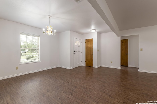 109 Sumac, New Braunfels, TX 78130 - spare room with a chandelier, dark wood-style floors, and baseboards