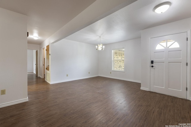 109 Sumac, New Braunfels, TX 78130 - entrance foyer featuring a chandelier, dark wood finished floors, and baseboards
