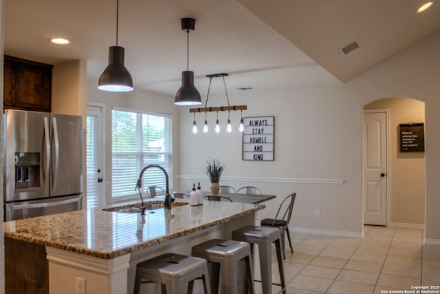 2073 Robin Hood, Canyon Lake, TX 78133 - kitchen featuring a sink, stainless steel fridge with ice dispenser, baseboards, light stone countertops, and recessed lighting