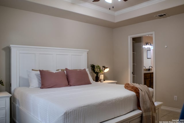 2073 Robin Hood, Canyon Lake, TX 78133 - bedroom featuring crown molding, ensuite bathroom, a ceiling fan, light tile patterned flooring, and baseboards