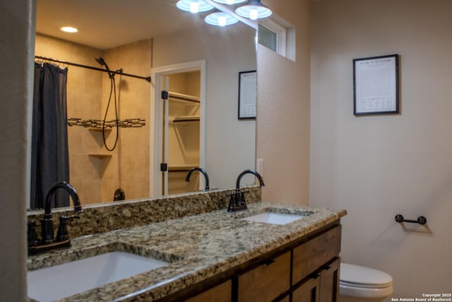 2073 Robin Hood, Canyon Lake, TX 78133 - full bathroom featuring toilet, a shower with curtain, and double vanity