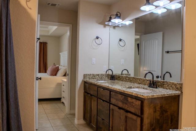 2073 Robin Hood, Canyon Lake, TX 78133 - ensuite bathroom with tile patterned floors and double vanity