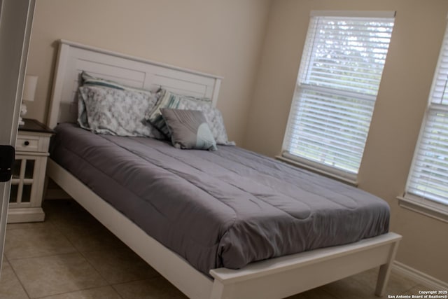 2073 Robin Hood, Canyon Lake, TX 78133 - bedroom with light tile patterned floors and baseboards