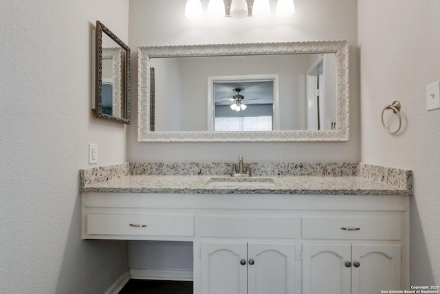 8915 Datapoint Unit 49A, San Antonio, TX 78229 - bathroom with vanity and a ceiling fan