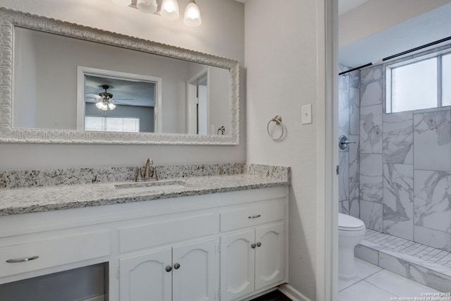 8915 Datapoint Unit 49A, San Antonio, TX 78229 - bathroom with toilet, a marble finish shower, vanity, and ceiling fan