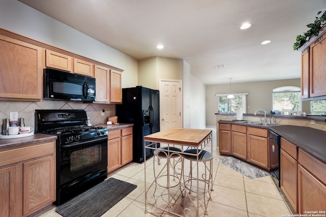 20710 Meandering Cir, San Antonio, TX 78258 - kitchen featuring black appliances, a sink, backsplash, dark countertops, and recessed lighting