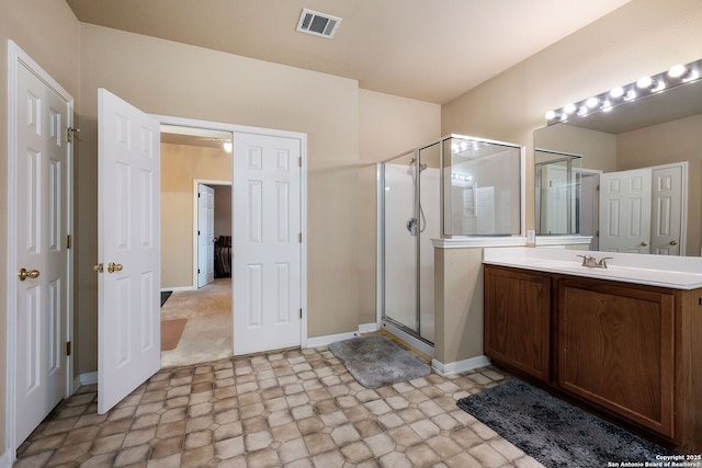 20710 Meandering Cir, San Antonio, TX 78258 - bathroom featuring vanity, a stall shower, baseboards, and stone finish floors