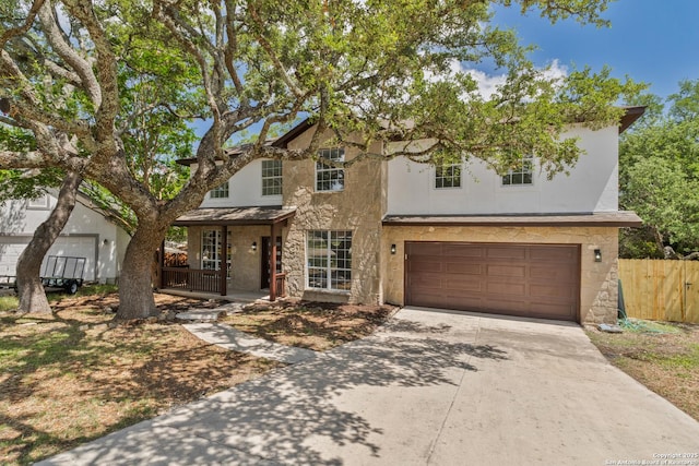 907 Amigo, San Antonio, TX 78260 - traditional home featuring stone siding, stucco siding, driveway, and an attached garage