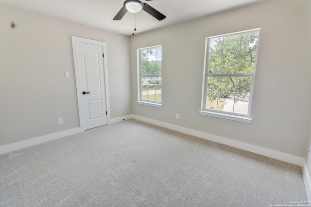 907 Amigo, San Antonio, TX 78260 - spare room with light carpet, a ceiling fan, and baseboards