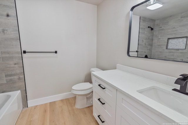 907 Amigo, San Antonio, TX 78260 - bathroom with wood finished floors, toilet, vanity, and baseboards