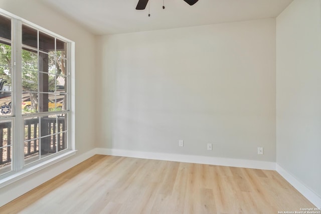907 Amigo, San Antonio, TX 78260 - empty room with wood finished floors, a ceiling fan, and baseboards