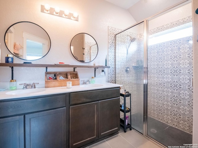 10760 Rosalina Loop, Converse, TX 78109 - full bathroom featuring a stall shower, double vanity, tile patterned flooring, and lofted ceiling
