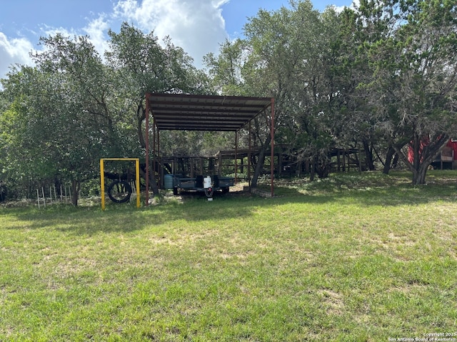 952 Madrona Rd, Pipe Creek, TX 78063 - view of green lawn featuring a detached carport and view of scattered trees