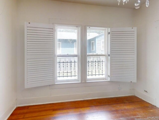 519 Huisache, San Antonio, TX 78212 - spare room with wood finished floors, healthy amount of natural light, and baseboards