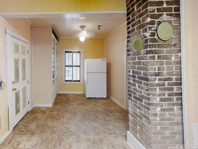 519 Huisache, San Antonio, TX 78212 - kitchen with freestanding refrigerator, ornamental molding, wood walls, and baseboards