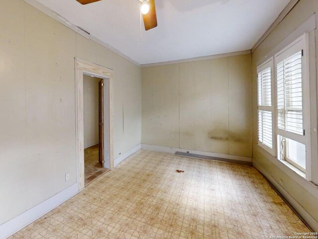 519 Huisache, San Antonio, TX 78212 - unfurnished room with ceiling fan, crown molding, tile patterned floors, and baseboards