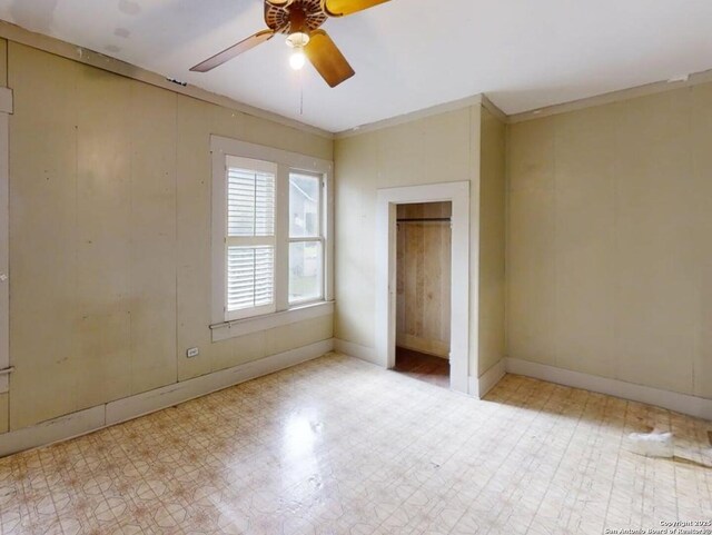 519 Huisache, San Antonio, TX 78212 - unfurnished bedroom featuring baseboards, tile patterned floors, ornamental molding, and ceiling fan