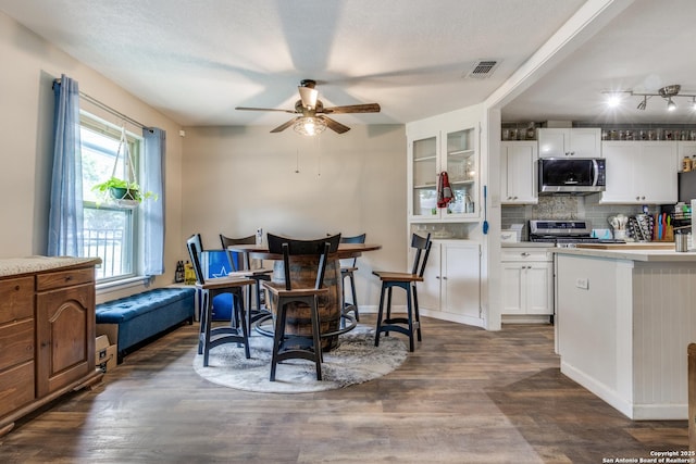 6034 Royal, San Antonio, TX 78239 - dining room featuring a ceiling fan and dark wood finished floors