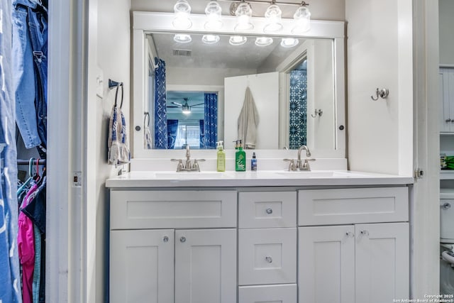 6034 Royal, San Antonio, TX 78239 - full bath with double vanity, toilet, and a closet