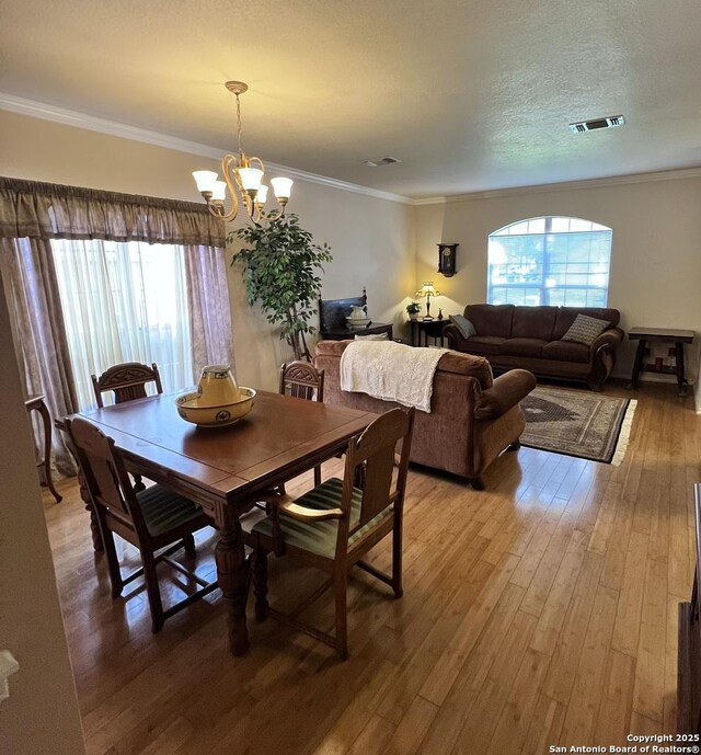 1110 Tetford, San Antonio, TX 78253 - dining space featuring a chandelier, light wood-style flooring, and ornamental molding