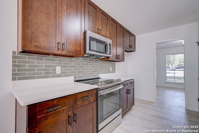 3250 Bear Spgs, San Antonio, TX 78245 - kitchen with stainless steel appliances, tasteful backsplash, and light countertops
