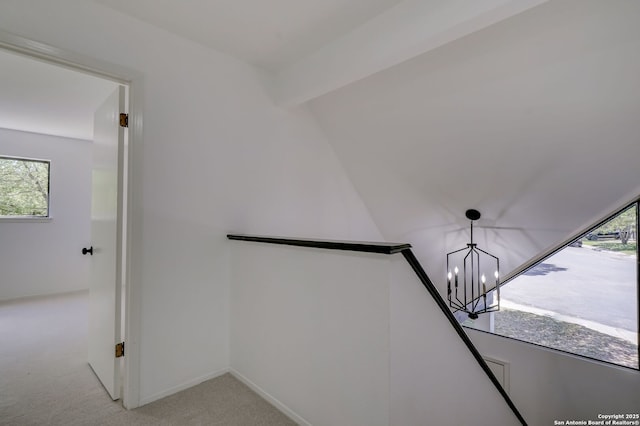 3250 Bear Spgs, San Antonio, TX 78245 - hallway with light colored carpet, plenty of natural light, a chandelier, and an upstairs landing