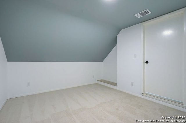 3250 Bear Spgs, San Antonio, TX 78245 - additional living space with lofted ceiling, baseboards, and carpet floors