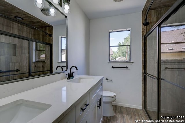 3250 Bear Spgs, San Antonio, TX 78245 - bathroom featuring healthy amount of natural light, tiled shower, toilet, and double vanity