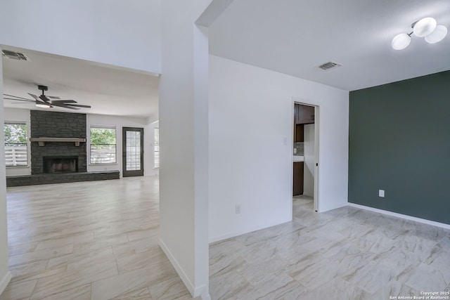 3250 Bear Spgs, San Antonio, TX 78245 - empty room featuring ceiling fan, a fireplace, and baseboards