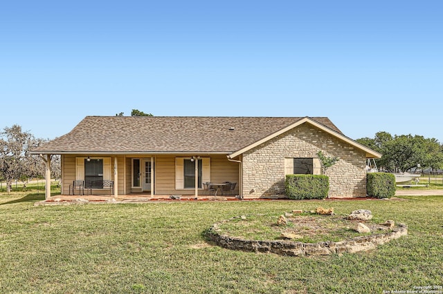 1608 Kings Ranch Rd, Bandera, TX 78003 - ranch-style house featuring a front yard, covered porch, stone siding, and roof with shingles