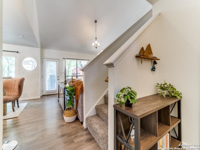 2154 Pecan Holw, San Antonio, TX 78232 - staircase featuring wood finished floors, lofted ceiling, a chandelier, and baseboards