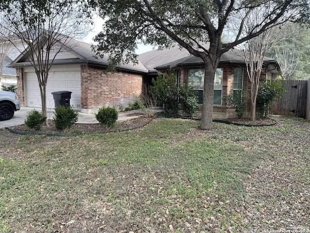 4122 Chinkapin Oak, San Antonio, TX 78223 - view of front of house featuring brick siding, an attached garage, and concrete driveway