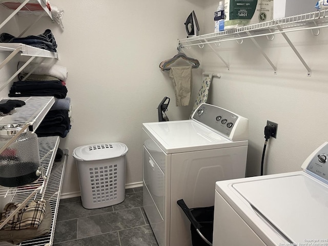 4122 Chinkapin Oak, San Antonio, TX 78223 - laundry area featuring washer and clothes dryer, baseboards, and dark tile patterned floors