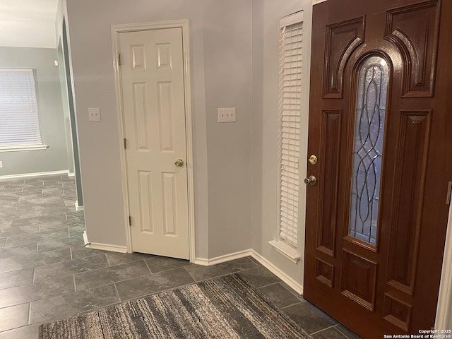 4122 Chinkapin Oak, San Antonio, TX 78223 - foyer featuring baseboards and dark stone finish floors