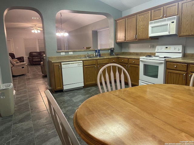 4122 Chinkapin Oak, San Antonio, TX 78223 - kitchen with white appliances, arched walkways, a sink, a ceiling fan, and brown cabinetry