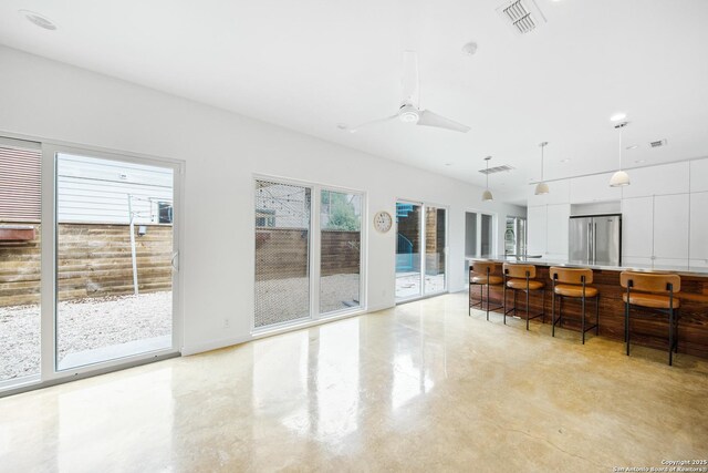 543 Leigh, San Antonio, TX 78210 - living room with a ceiling fan and finished concrete flooring