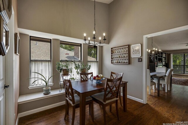 7011 Washita Way, San Antonio, TX 78256 - dining area featuring a chandelier, wood finished floors, baseboards, and a high ceiling