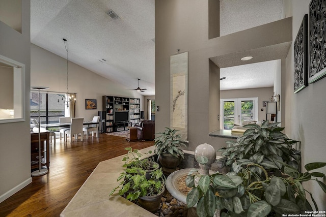 7011 Washita Way, San Antonio, TX 78256 - dining area featuring high vaulted ceiling, wood finished floors, a textured ceiling, ceiling fan, and a chandelier