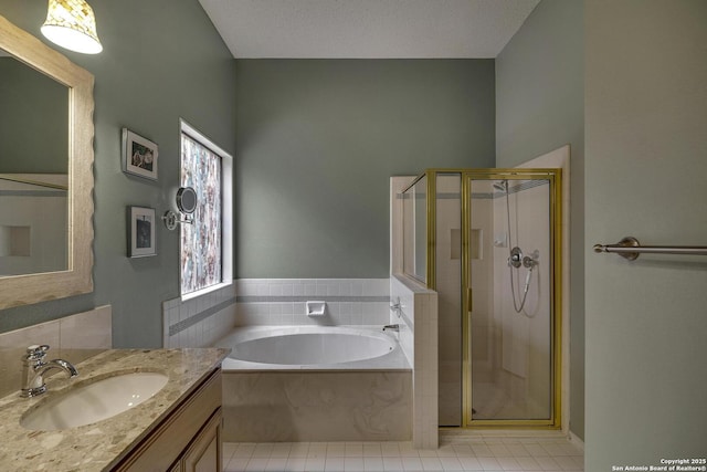 7011 Washita Way, San Antonio, TX 78256 - bathroom featuring a stall shower, vanity, a garden tub, and tile patterned flooring