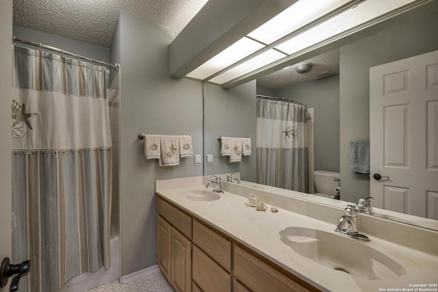 7011 Washita Way, San Antonio, TX 78256 - bathroom featuring a textured ceiling, toilet, double vanity, tile patterned floors, and shower / bath combo