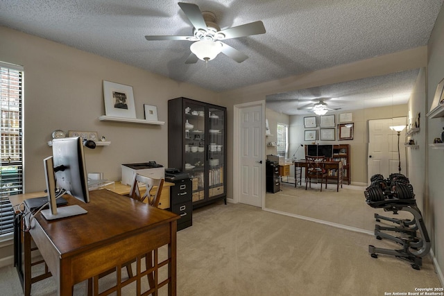 7011 Washita Way, San Antonio, TX 78256 - office area featuring a ceiling fan, light carpet, a textured ceiling, and plenty of natural light