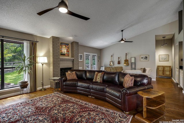 7011 Washita Way, San Antonio, TX 78256 - living area featuring a ceiling fan, healthy amount of natural light, lofted ceiling, a textured ceiling, and wood finished floors