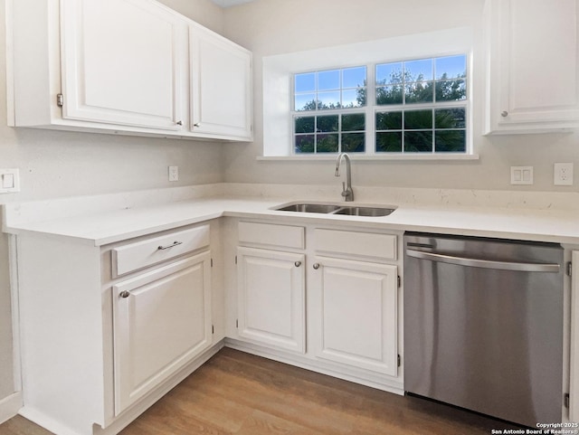 334 Sunrose, Cibolo, TX 78108 - kitchen featuring dishwasher, a sink, white cabinets, light countertops, and light wood-type flooring
