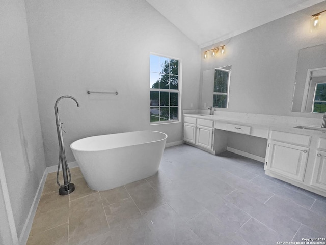 334 Sunrose, Cibolo, TX 78108 - full bath with double vanity, lofted ceiling, a freestanding bath, tile patterned floors, and baseboards